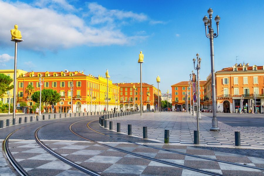 View of Massena square with red buildings in Nice, France